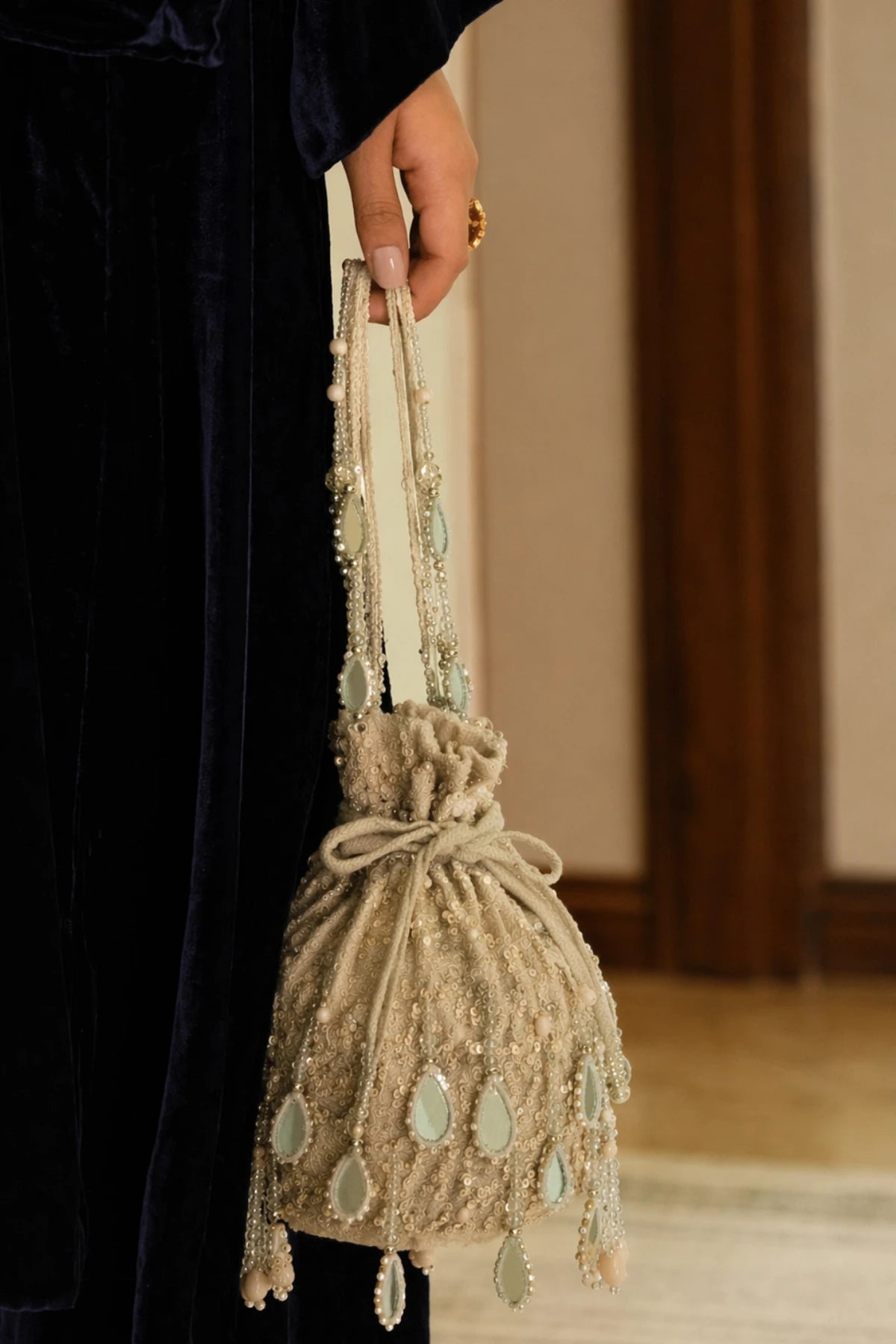 Handcrafted silver sequin potli bag with festive detailing