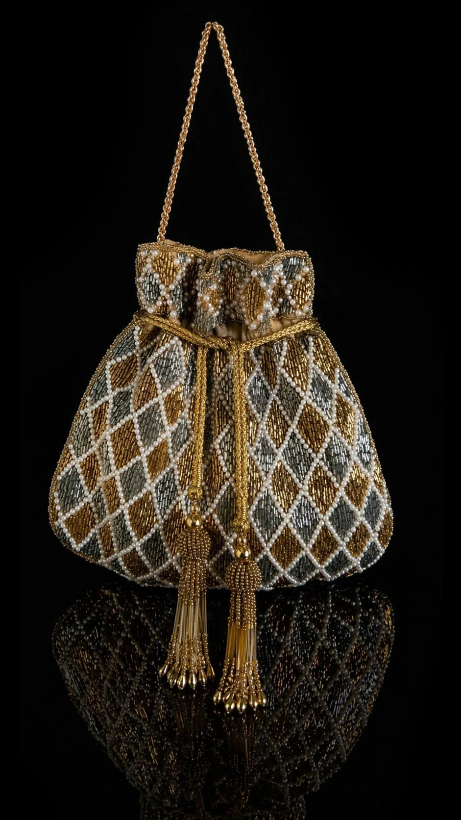 Handcrafted wedding potli bag with metallic accents and tassels