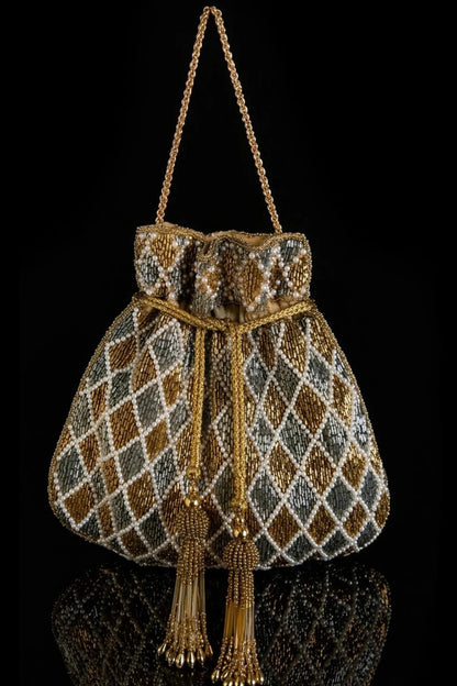 Handcrafted wedding potli bag with metallic accents and tassels