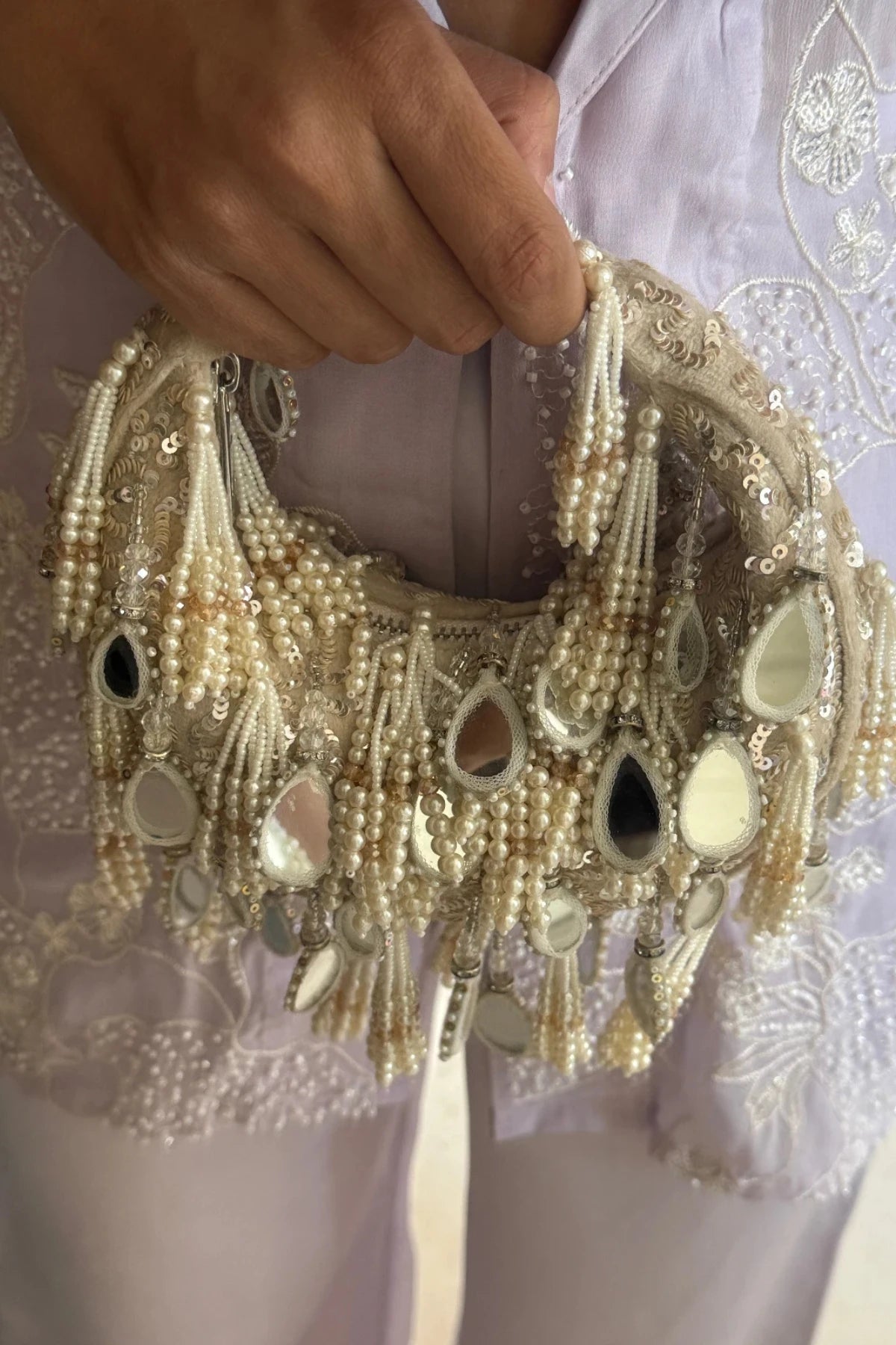 Festive hobo bag styled with a lehenga for celebrations