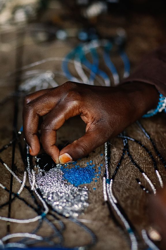Skilled Indian artisans crafting House of Siora bags by hand