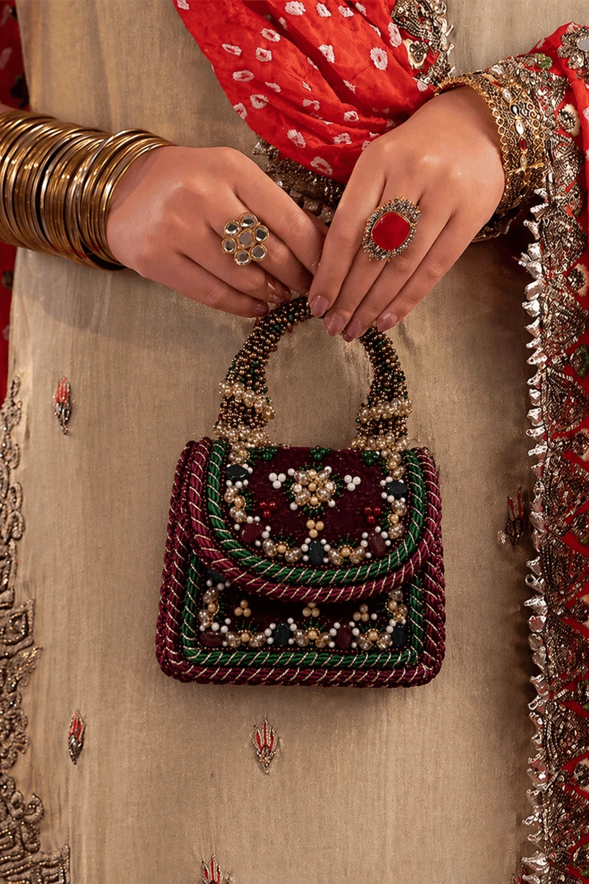 Women's wedding handbag with hand-beaded handle and floral detailing