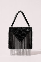 Black beaded sling bag with metallic fringe detailing and bold geometric silhouette