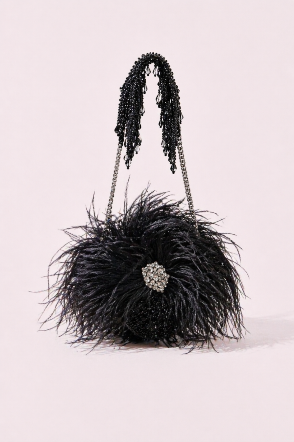 Black feather party bag with dramatic texture and sparkling crystal centerpiece