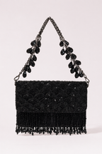 Black fringe evening handbag with intricate bead embroidery and statement chain detailing
