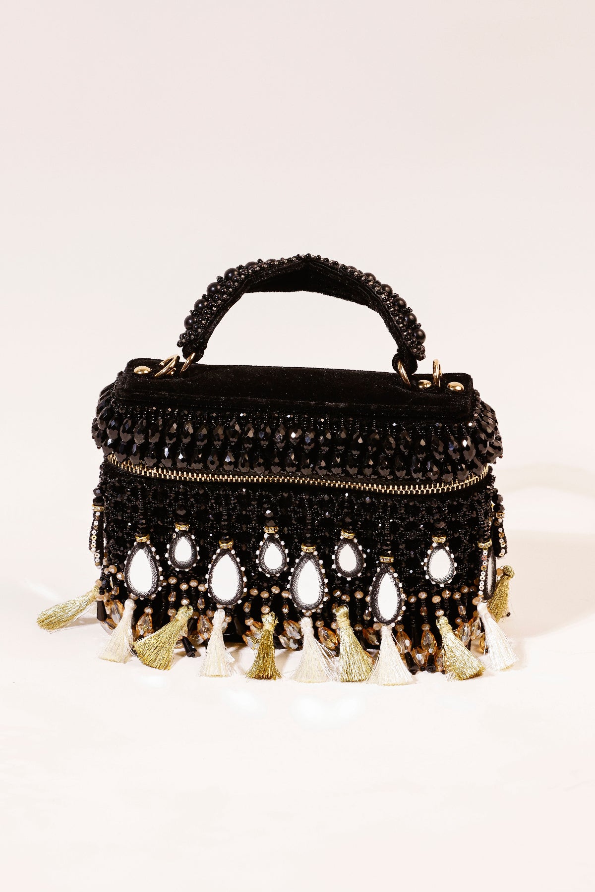 Black mirror embellished handbag with statement tassels and festive detailing