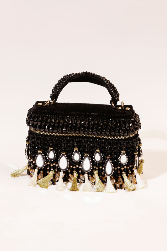 Black mirror embellished handbag with statement tassels and festive detailing