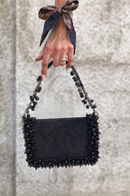 Black occasion party bag styled perfectly for celebrations and elegant night-out looks