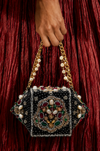 Black stone wedding guest handbag featuring handcrafted embellishments and pearl accents
