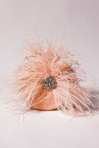 Pink feather shoulder bag with luxurious texture and handcrafted sparkle accents