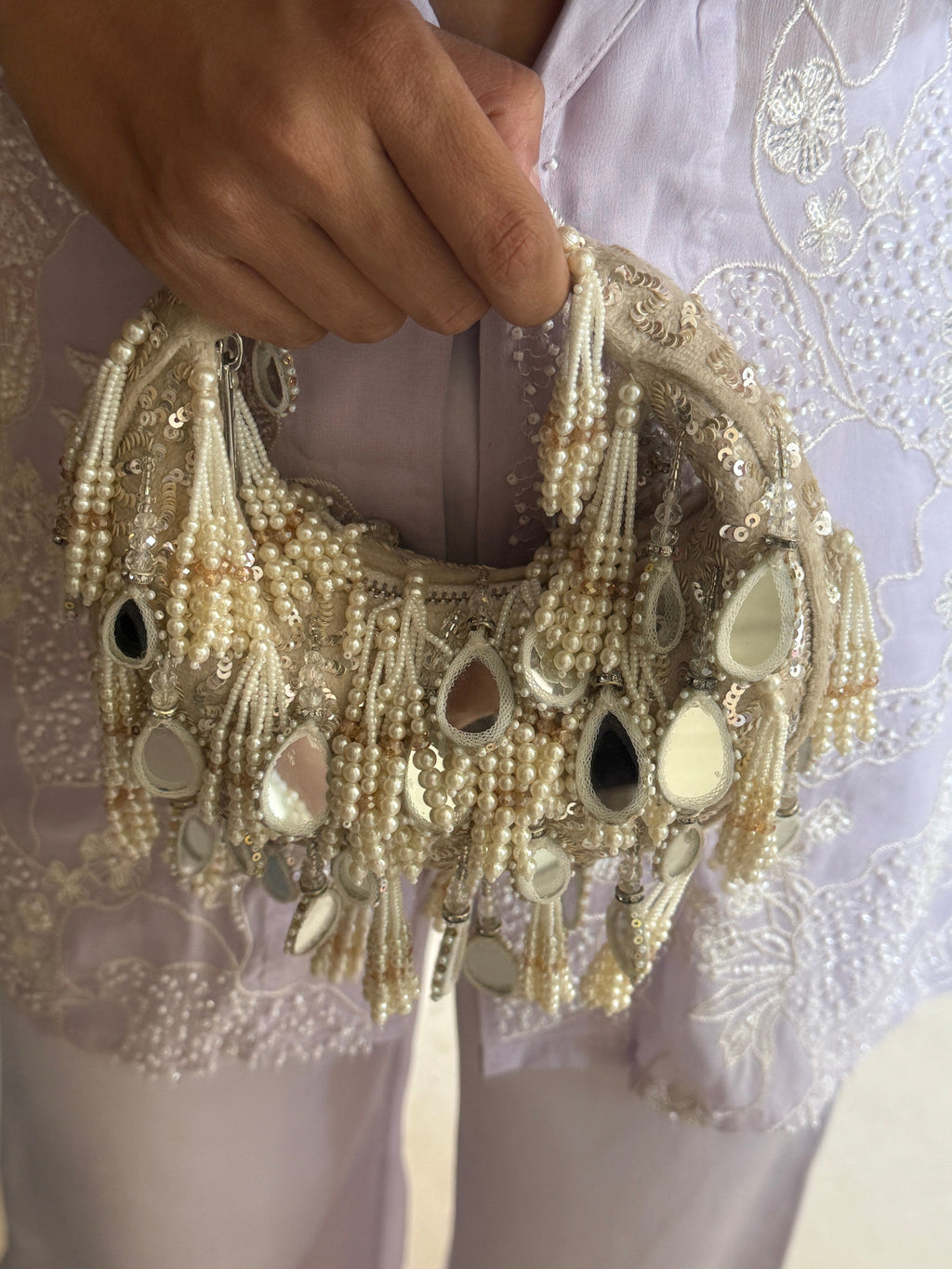 Boho glam party bag with cascading pearl tassels and statement mirror embellishments