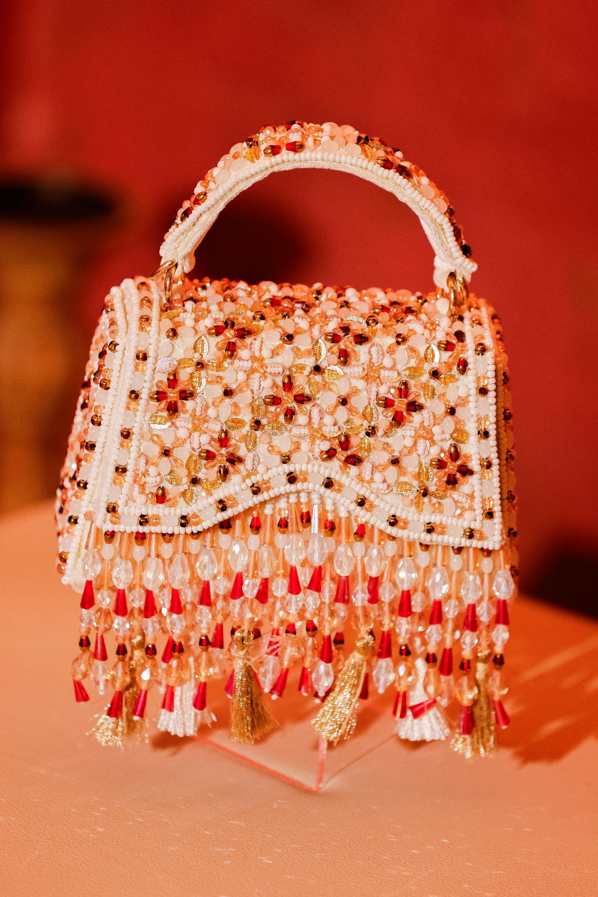 Bridal trousseau purse inspired by festive couture and handcrafted craftsmanship