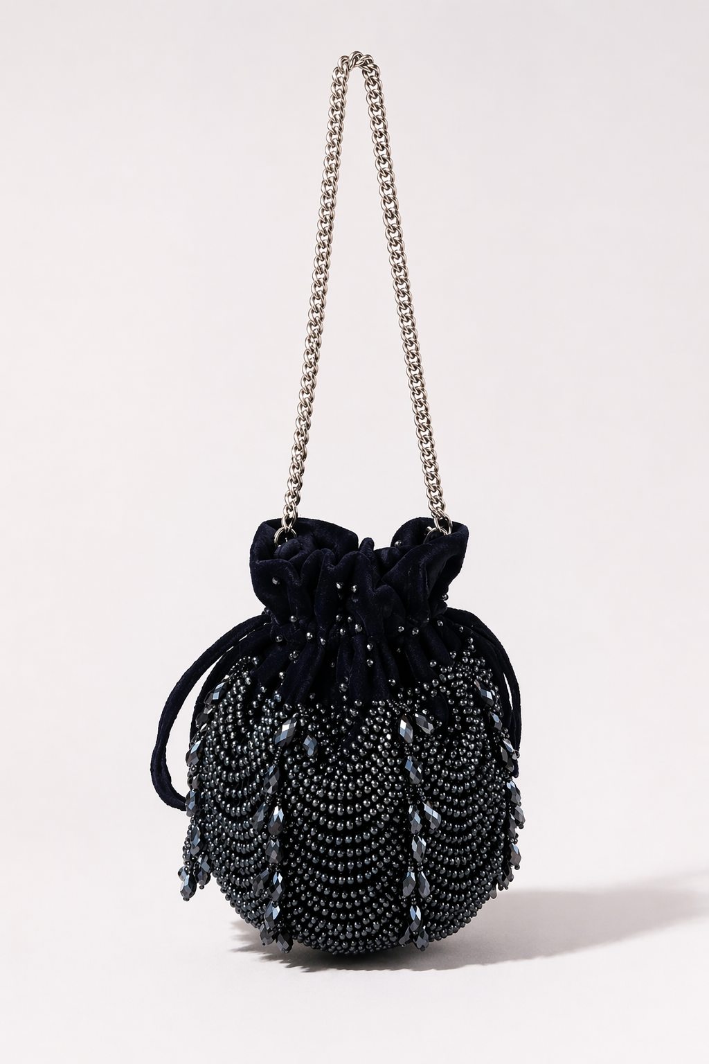 Charcoal blue beaded potli bag with layered embellishments and elegant festive detailing