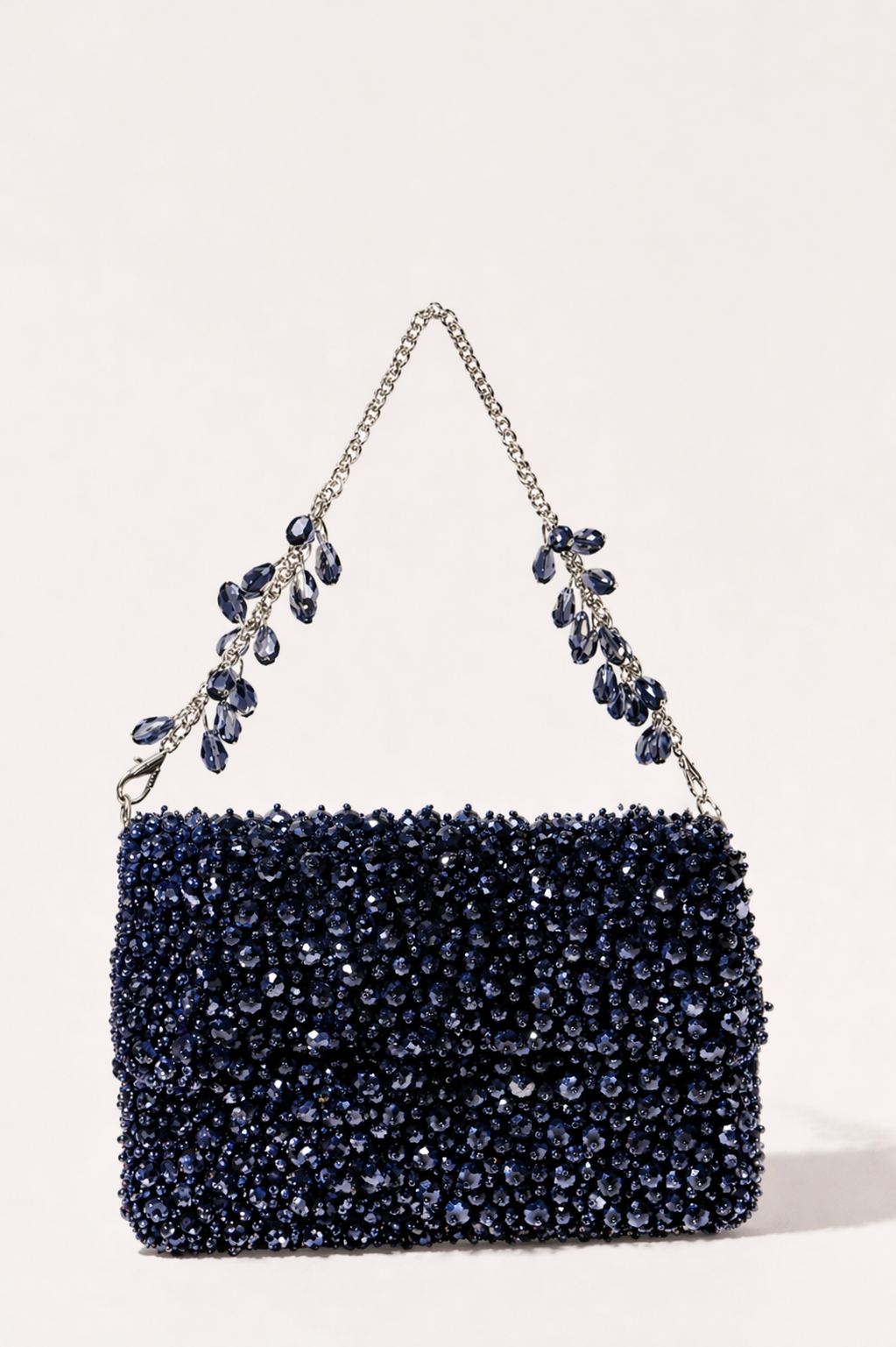 Charcoal blue crystal handbag with shimmering embellishments and jewel-inspired chain