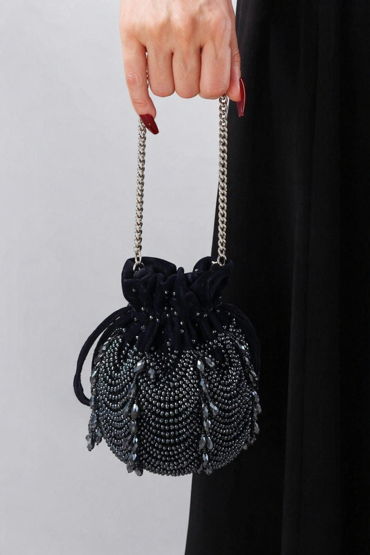 Charcoal blue festive drawstring handbag inspired by cocktail nights and celebration glamour