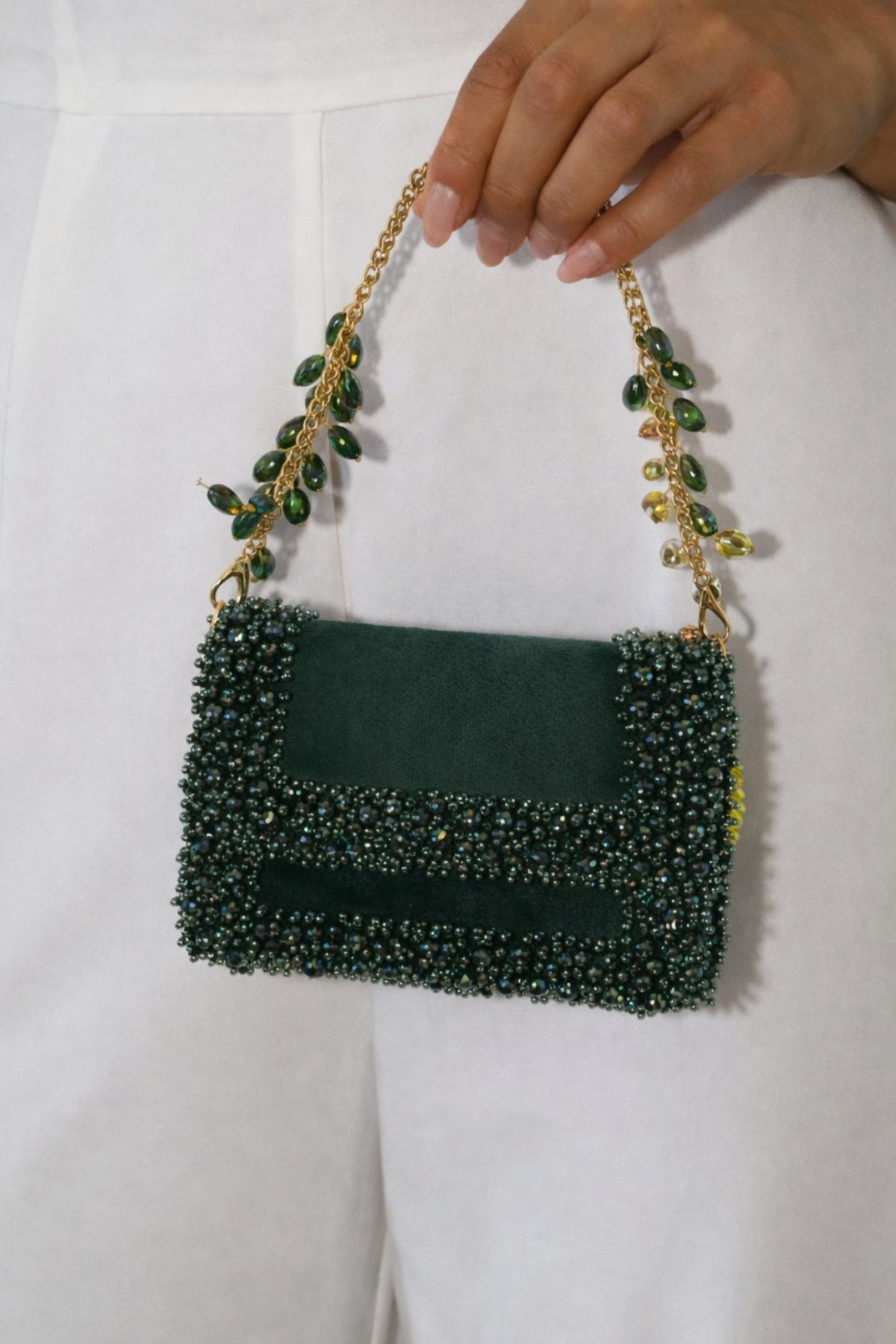 Dark green evening handbag inspired by cocktail celebrations and festive glamour