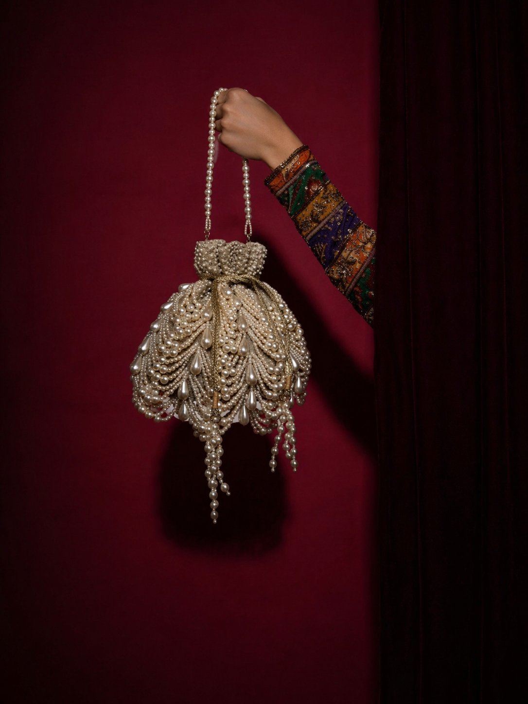 Designer pearl occasion potli designed beautifully for weddings and cocktail celebrations
