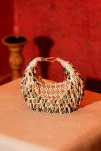 Statement occasion bag featuring cascading crystal beads and textured craftsmanship
