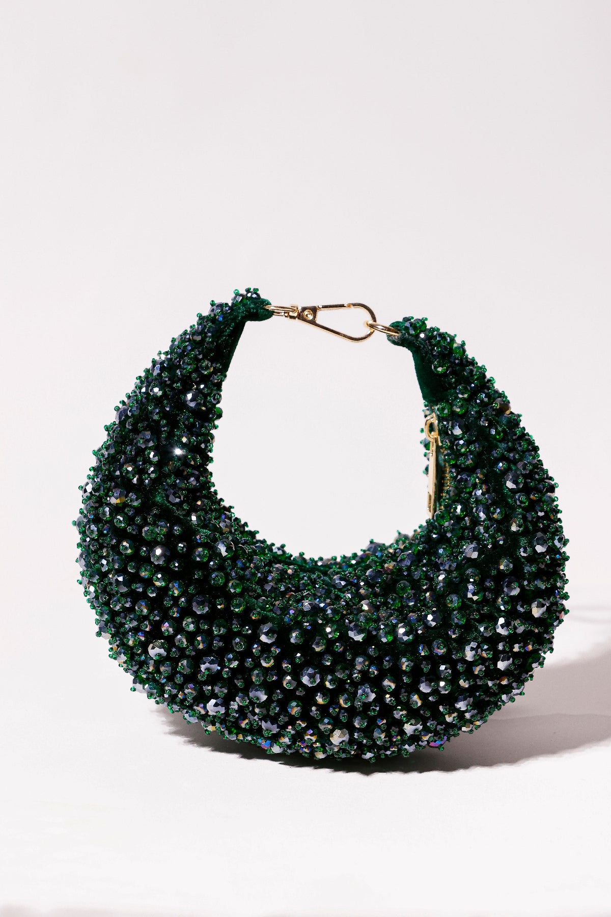 Emerald green beaded hobo bag with intricate crystal embellishments