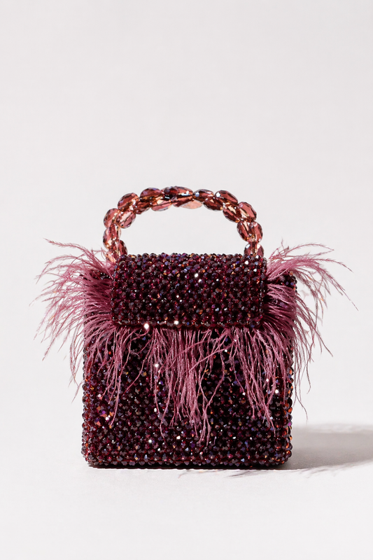 Feather mini bag with sparkling embellishments and statement party glamour