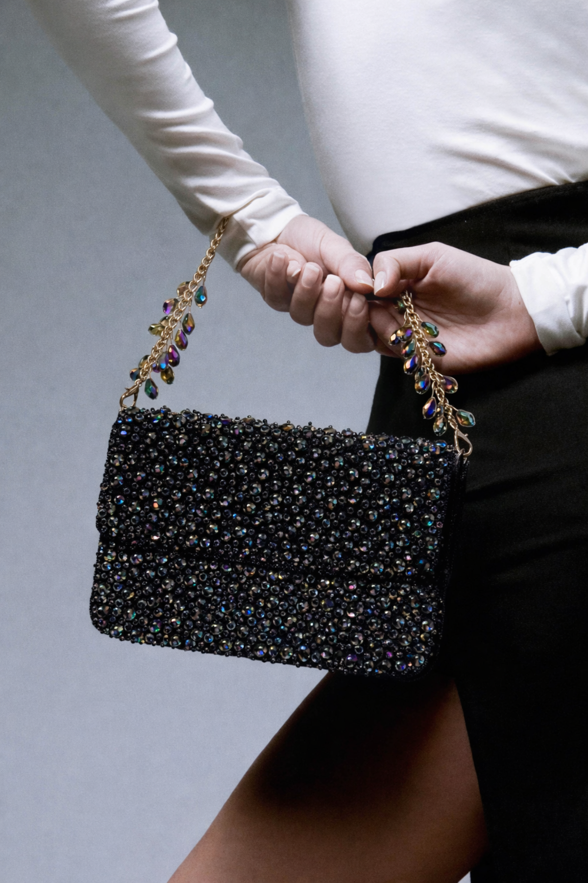 Gift-worthy designer bag featuring statement embellishments and timeless festive appeal