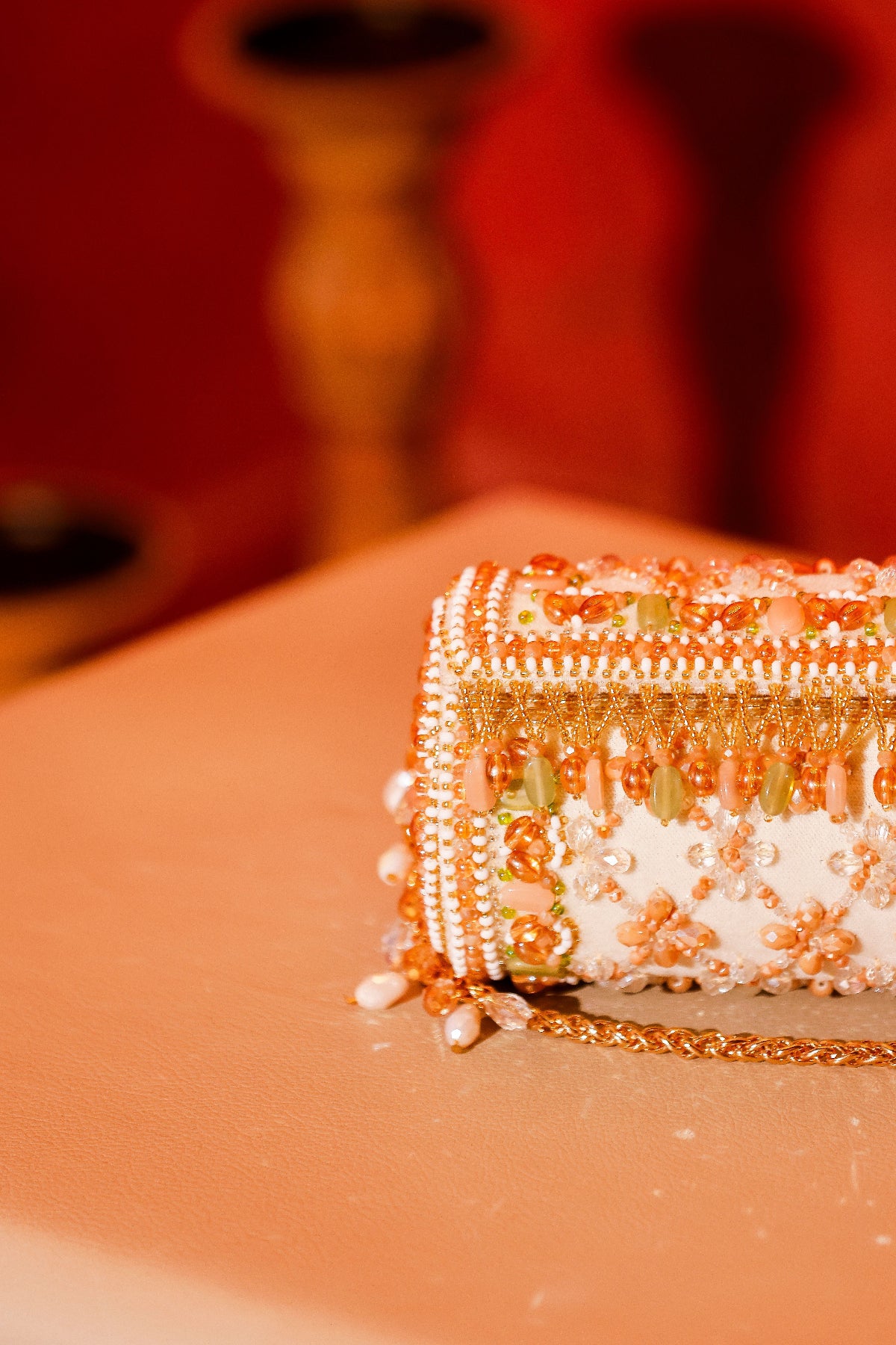 Gift-worthy festive bag featuring intricate embroidery and rich handcrafted detailing