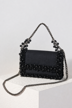 Glam black cocktail handbag with shimmering detailing and modern evening glamour