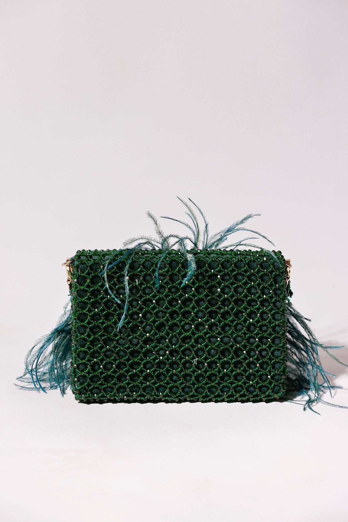 Cocktail-ready feather purse combining rich jewel tones
