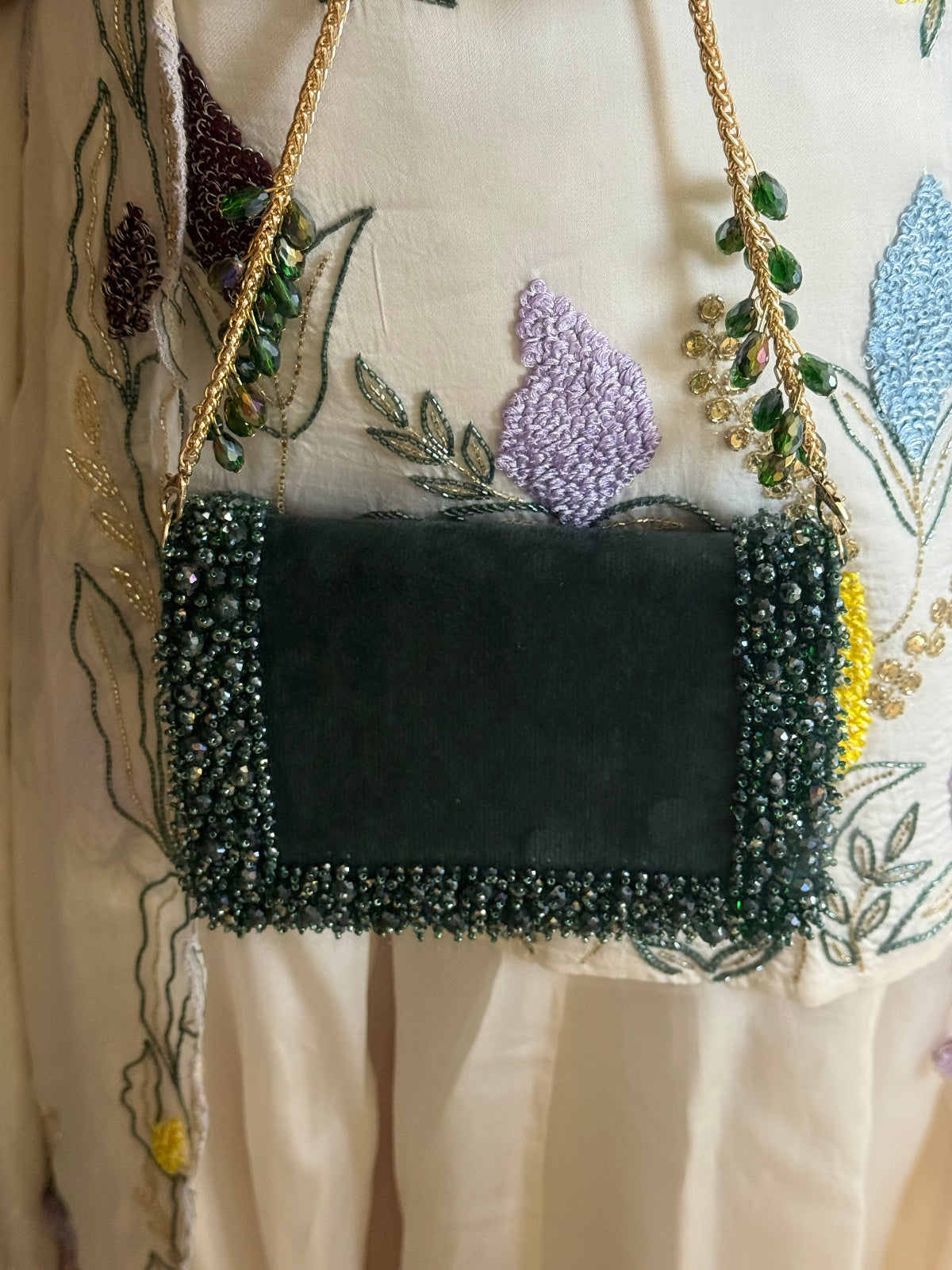 Glam green cocktail handbag with sparkling bead detailing and modern festive styling