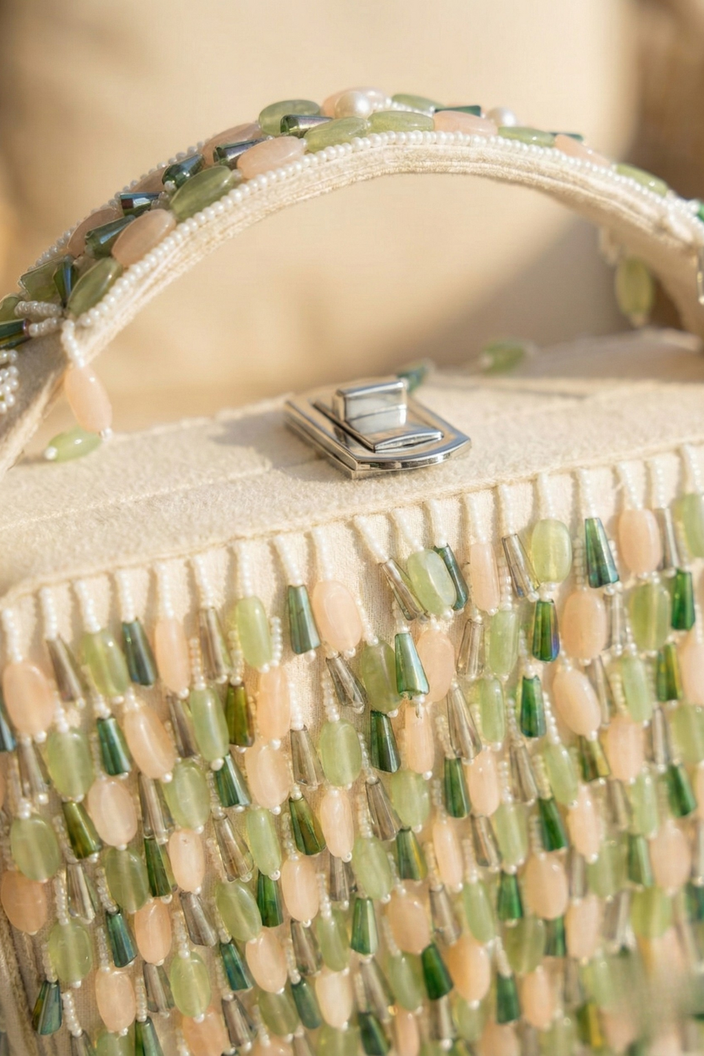 Glam resort-style handbag with cascading embellishments and contemporary elegance