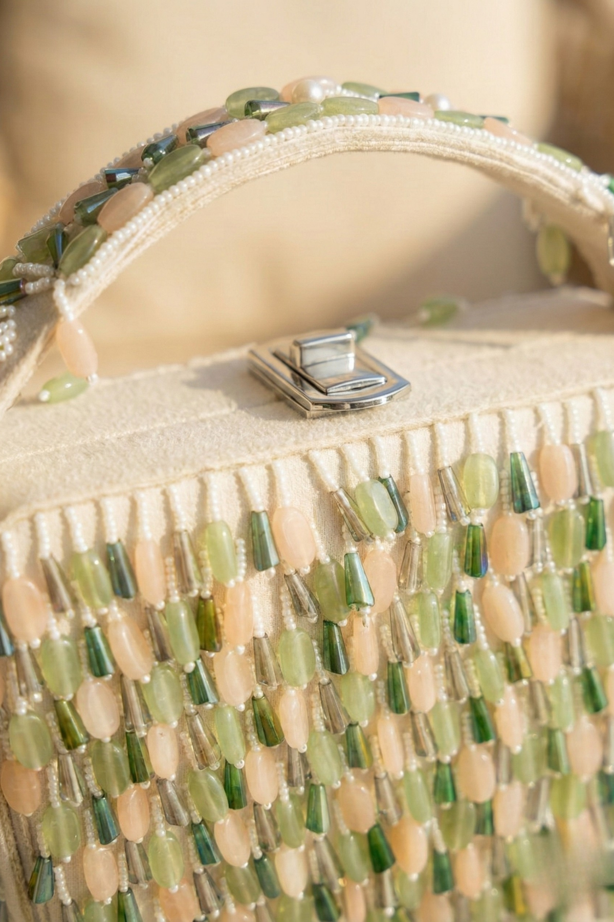 Glam resort-style handbag with cascading embellishments and contemporary elegance