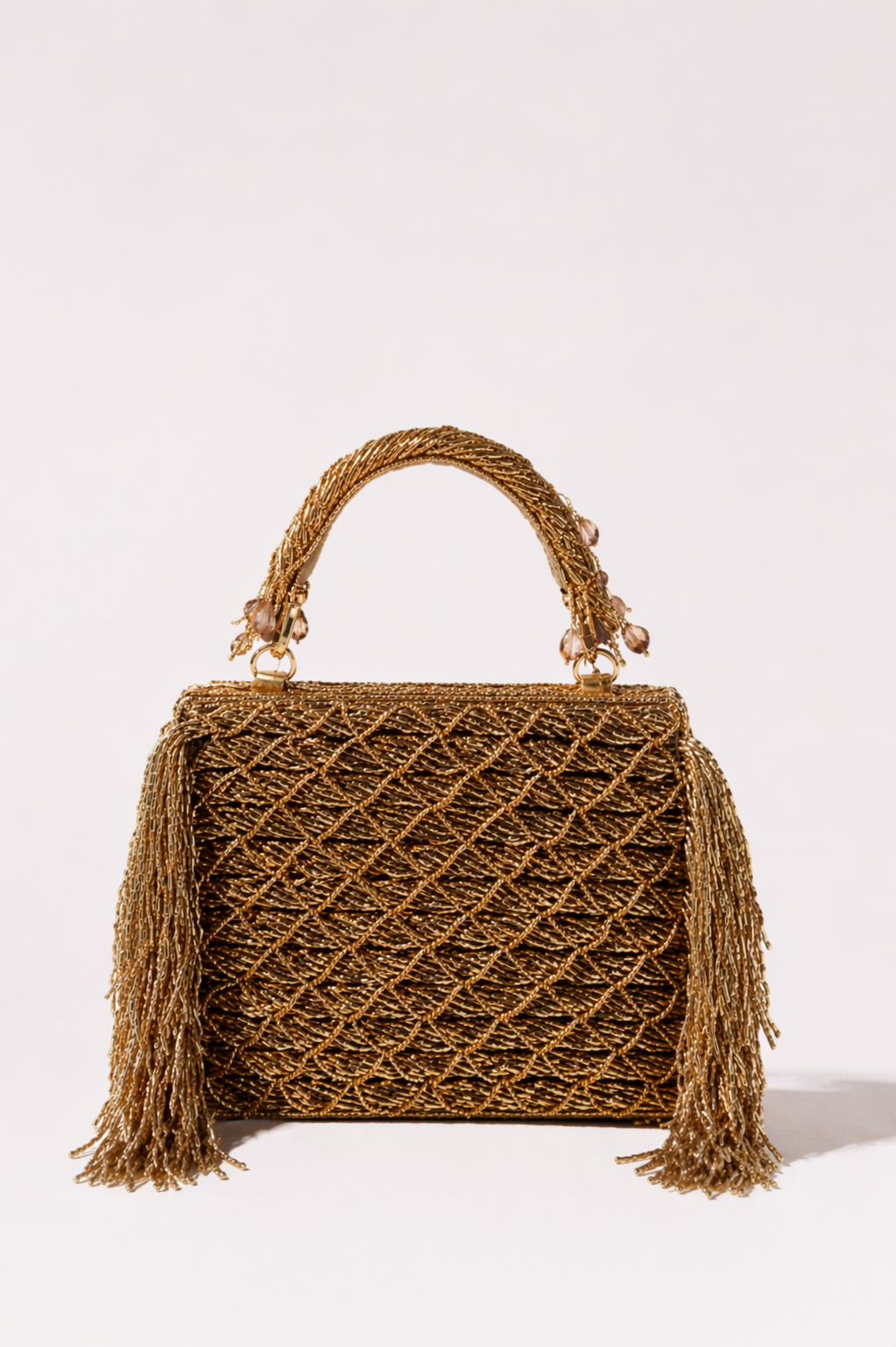 Gold bridal handbag with handcrafted woven detailing and elegant fringe accents