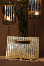 Cocktail-ready gold statement bag with intricate handcrafted embellishments