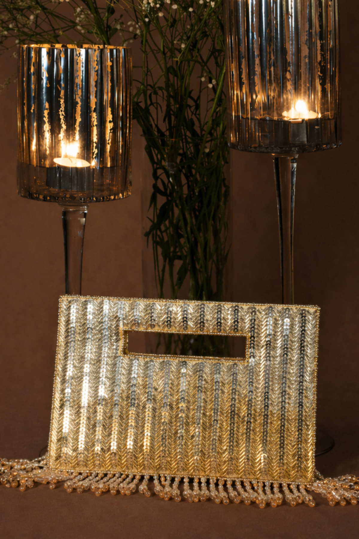 Cocktail-ready gold statement bag with intricate handcrafted embellishments