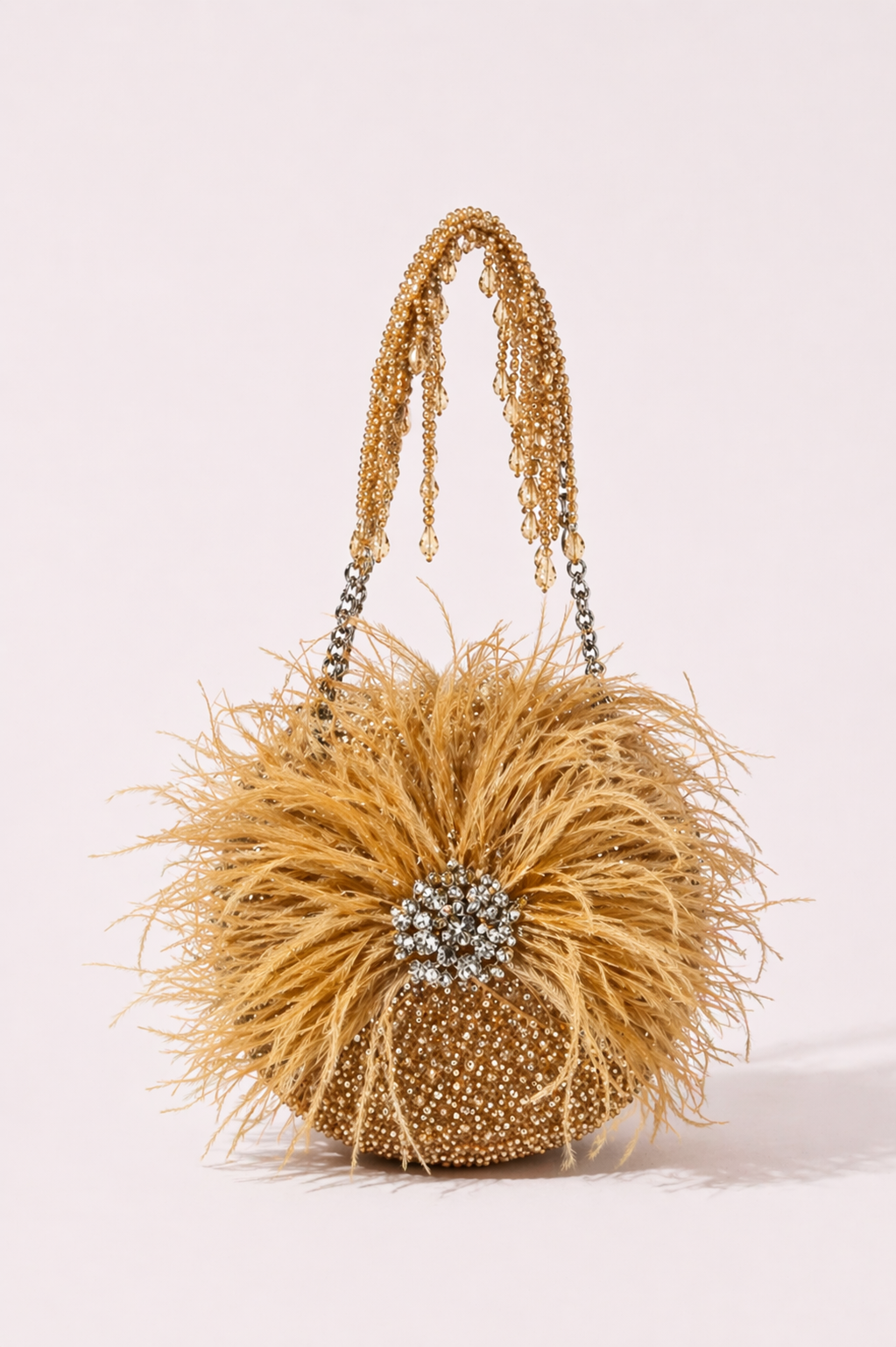 Gold feather party handbag with sparkling embellishments and dramatic festive texture