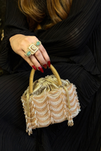 Gold festive drawstring handbag designed beautifully for receptions and celebration dressing