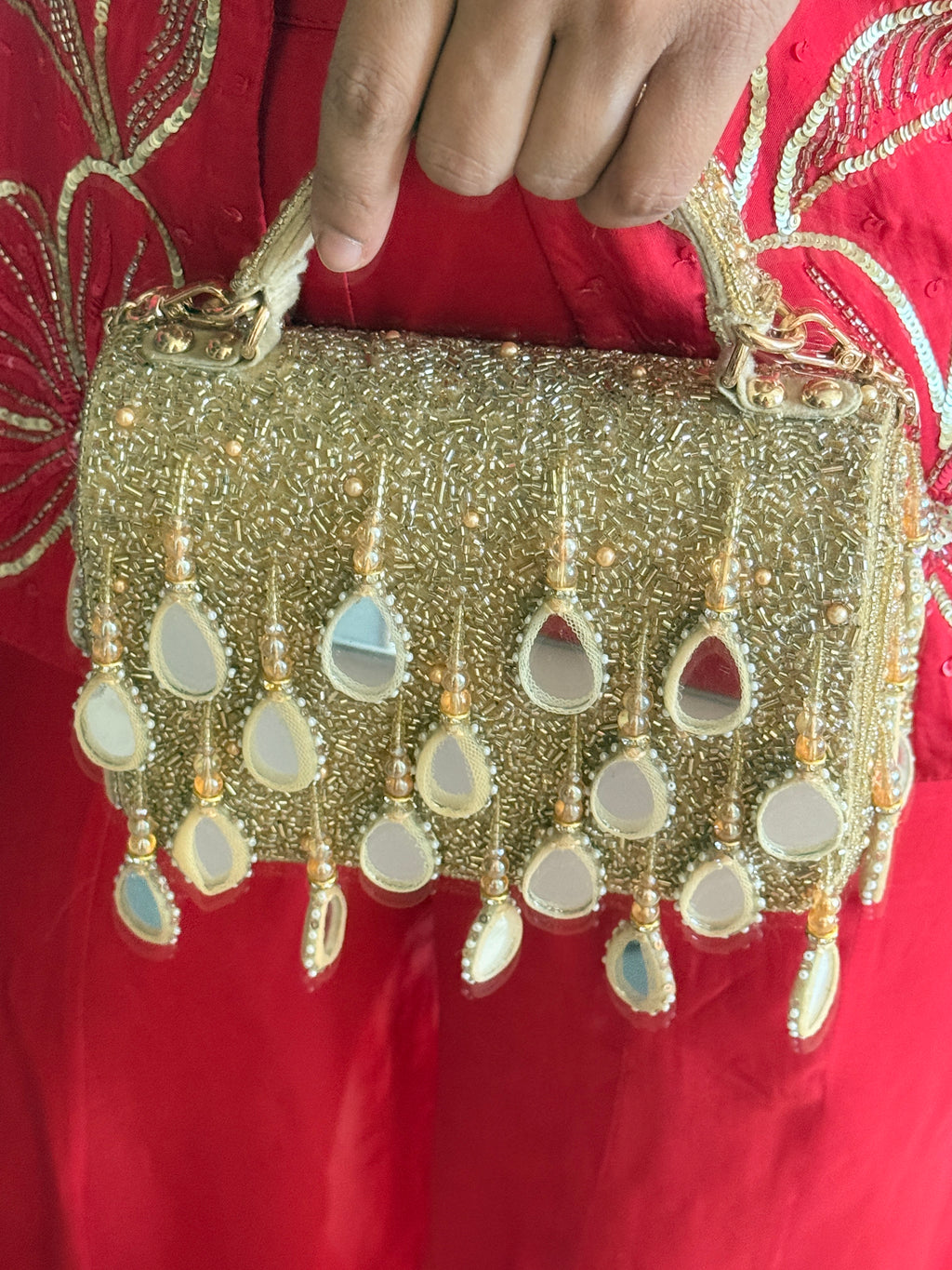Festive gold party handbag with intricate beadwork and luxe handcrafted glamour