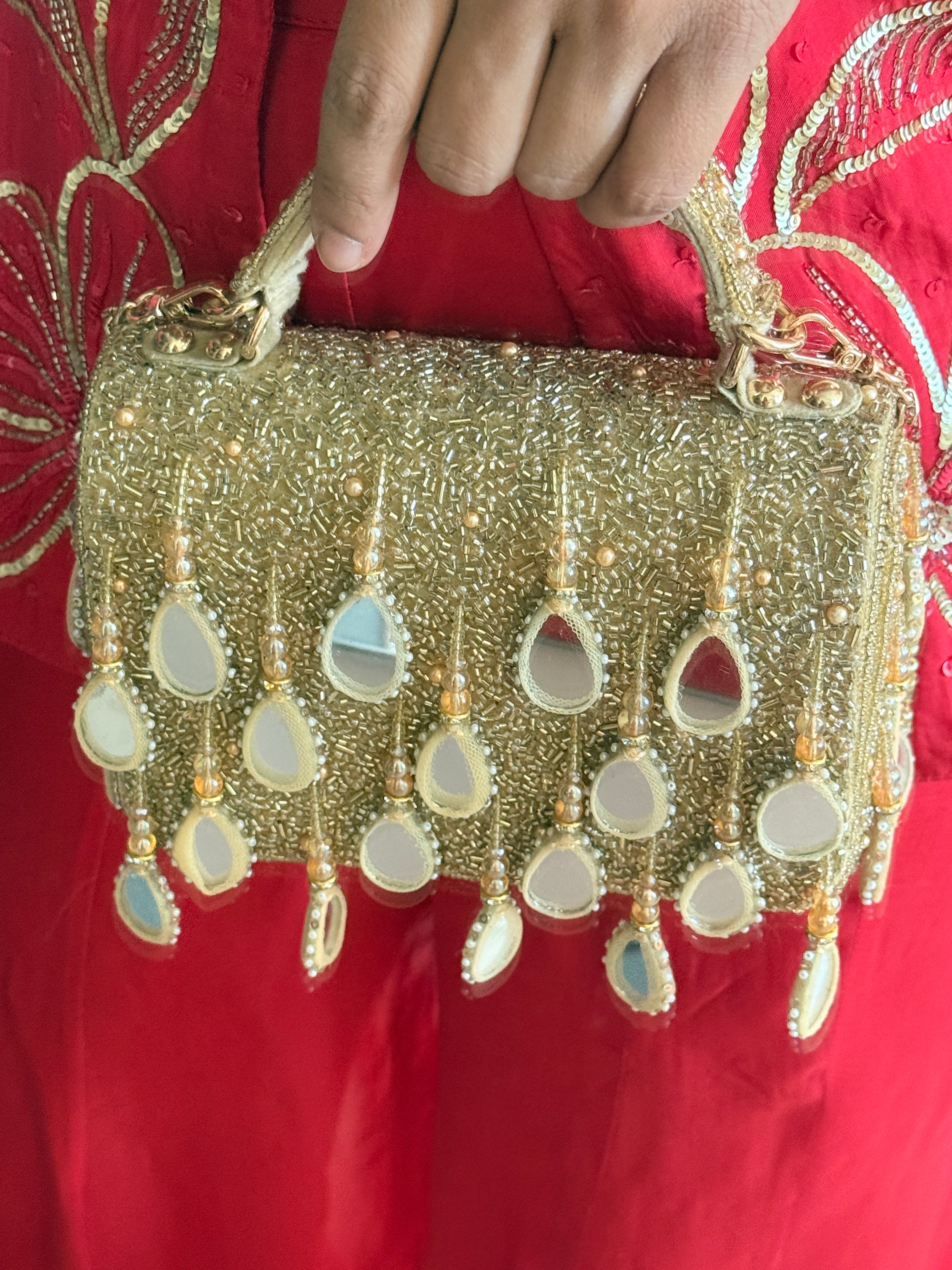 Festive gold party handbag with intricate beadwork and luxe handcrafted glamour