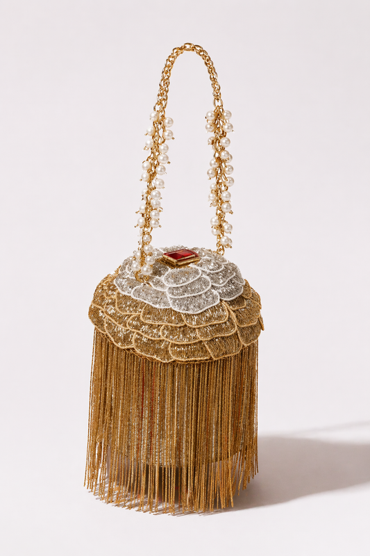 Gold fringe handbag with pearl detailing and dramatic festive tassel embellishments