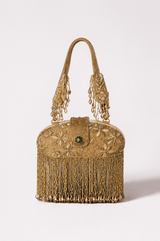 Gold embellished handbag with cascading fringe detailing and festive craftsmanship