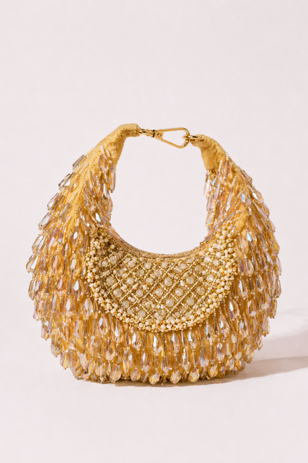 Gold beaded hobo bag with cascading crystal embellishments and festive handcrafted detailing