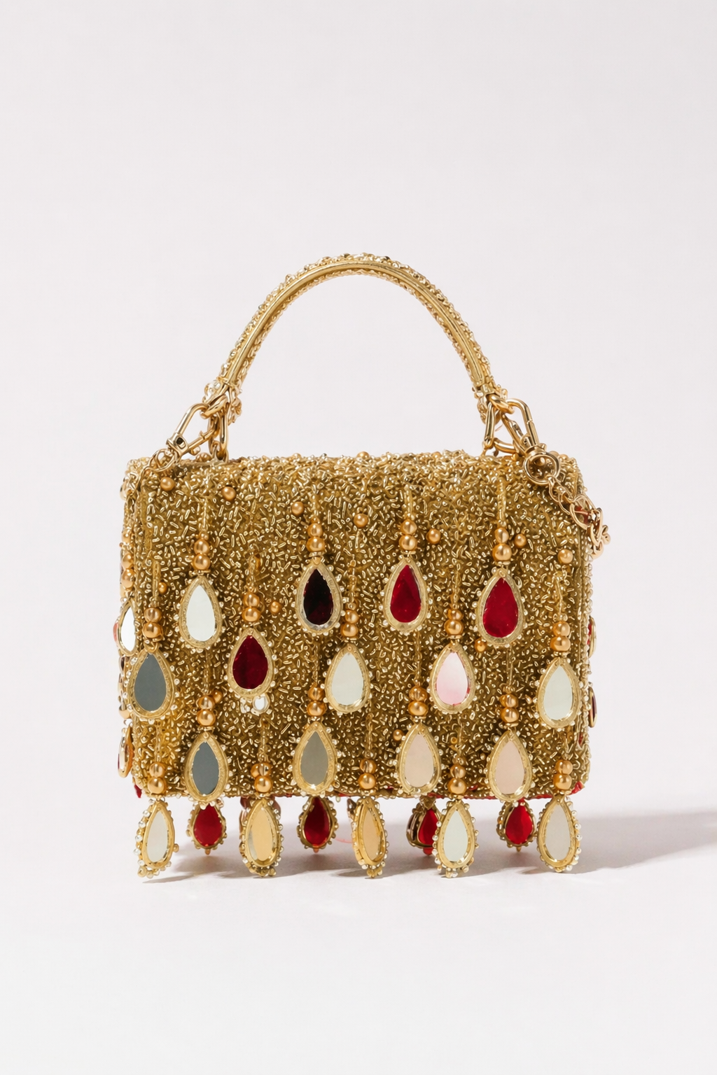 Gold mirror fringe handbag with statement embellishments and handcrafted festive detailing