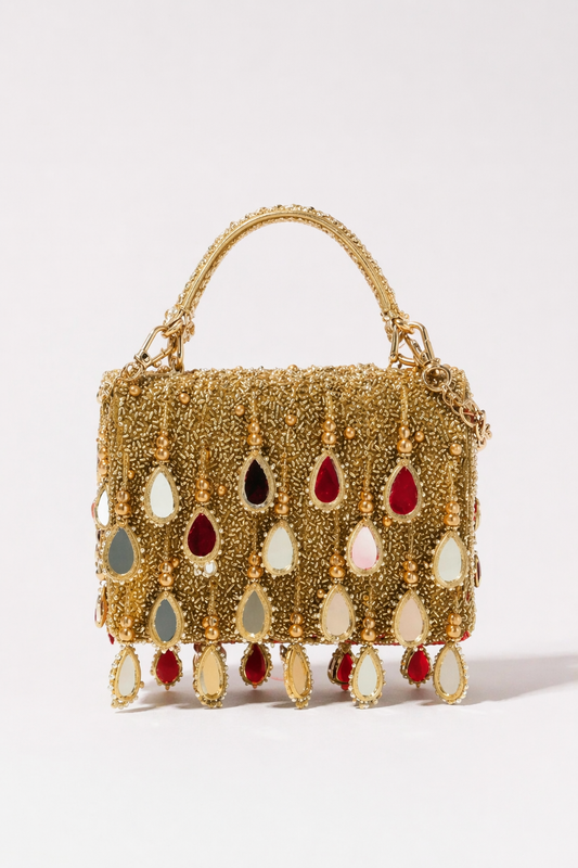 Gold mirror fringe handbag with statement embellishments and handcrafted festive detailing