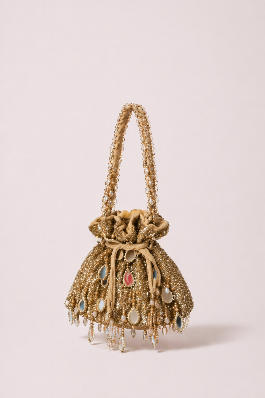 Gold potli handbag with intricate stone embellishments and handcrafted festive detailing