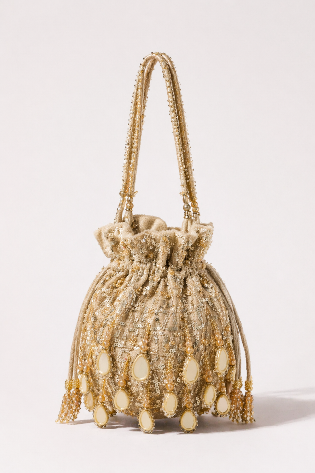 Golden potli handbag with mirror embellishments and handcrafted festive detailing