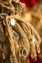 Gold stone embellished handbag designed beautifully for receptions and festive occasions
