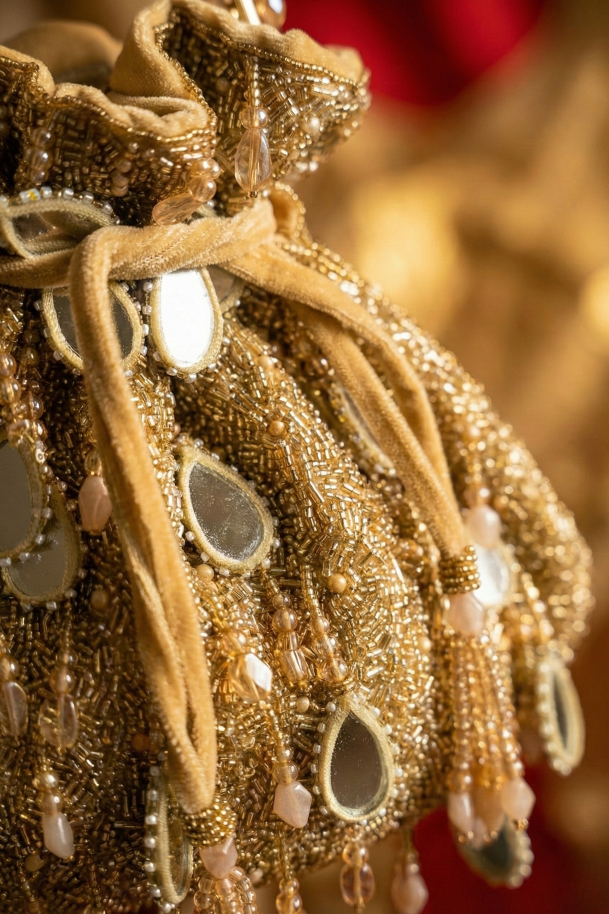 Gold stone embellished handbag designed beautifully for receptions and festive occasions