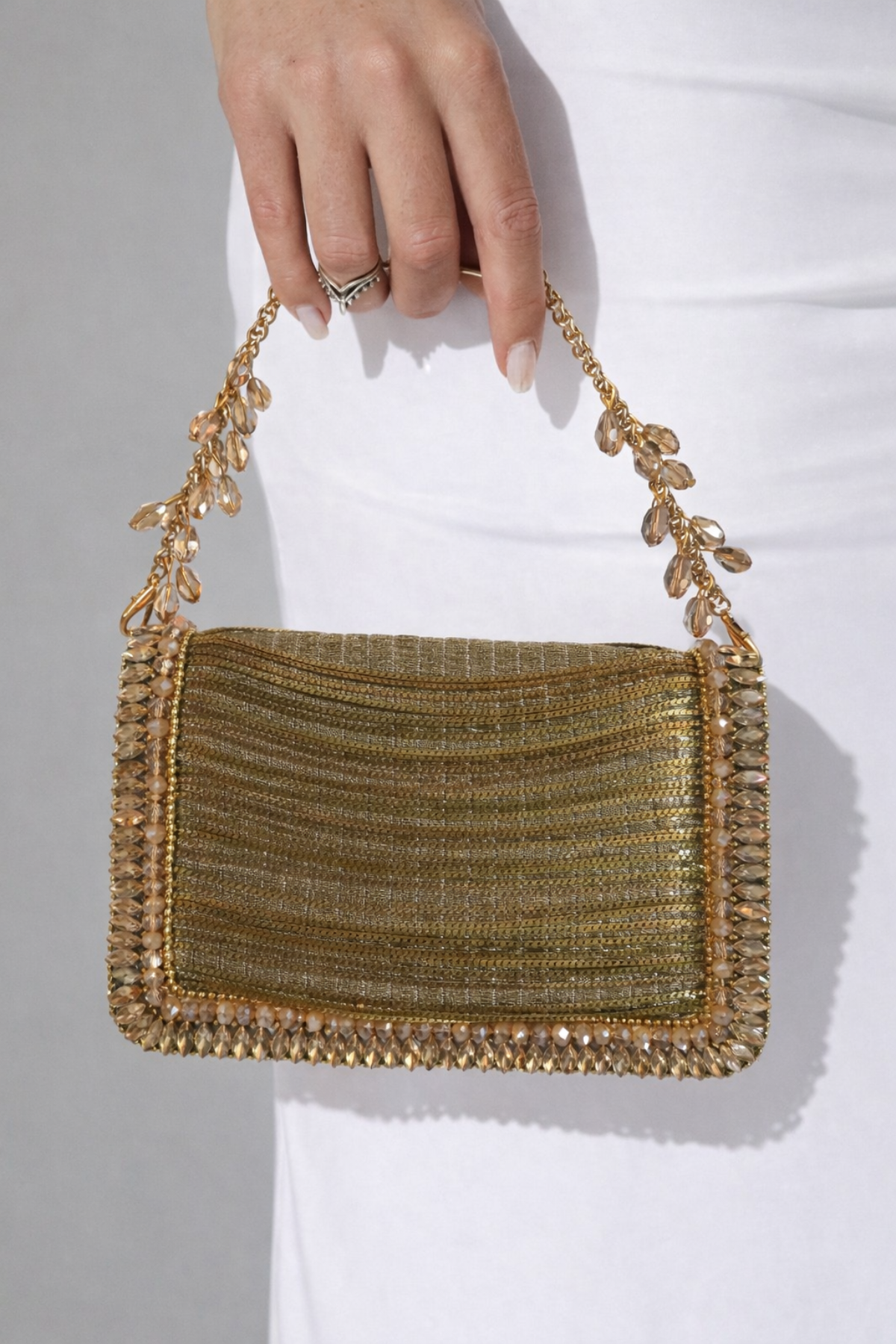 Gold wedding guest clutch designed beautifully for receptions and celebration dressing