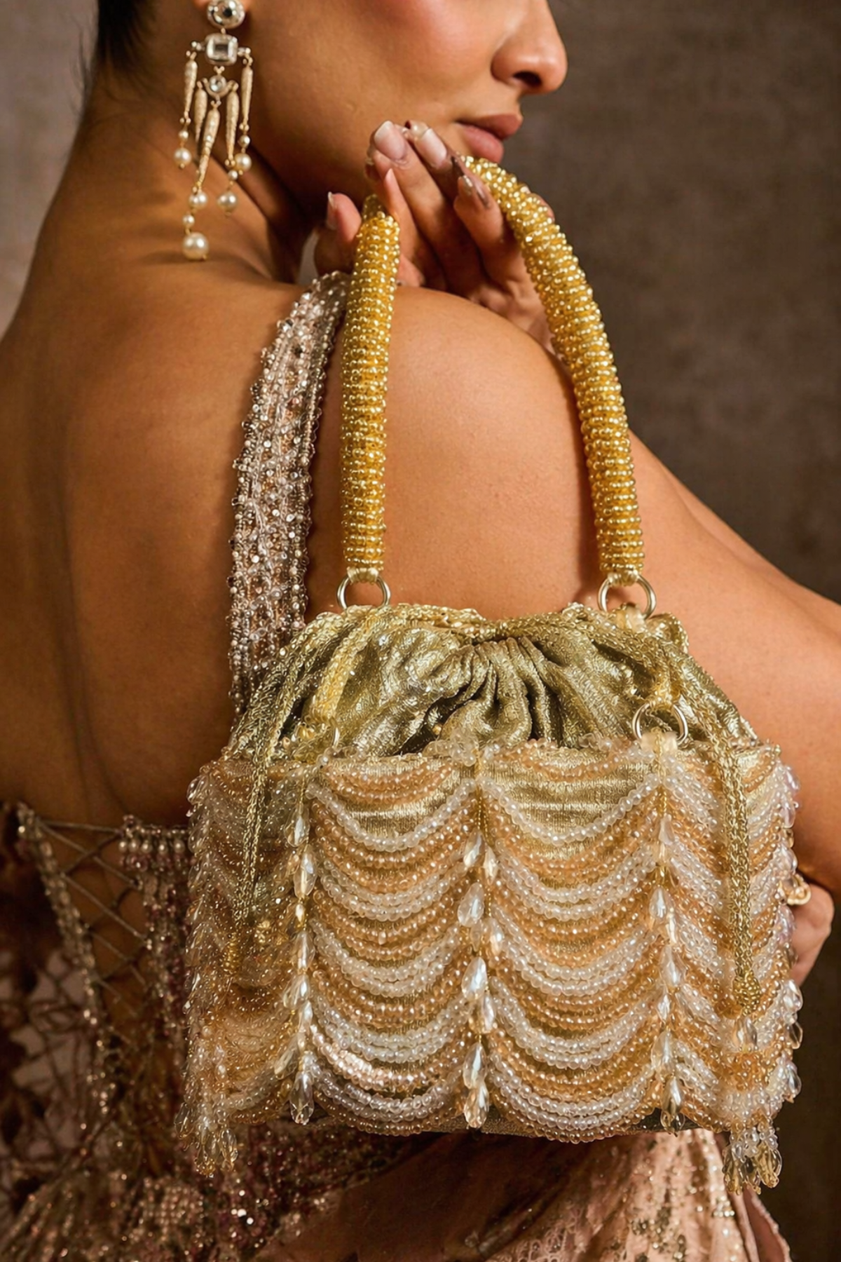 Golden beaded evening purse inspired by glamorous celebrations and cocktail styling