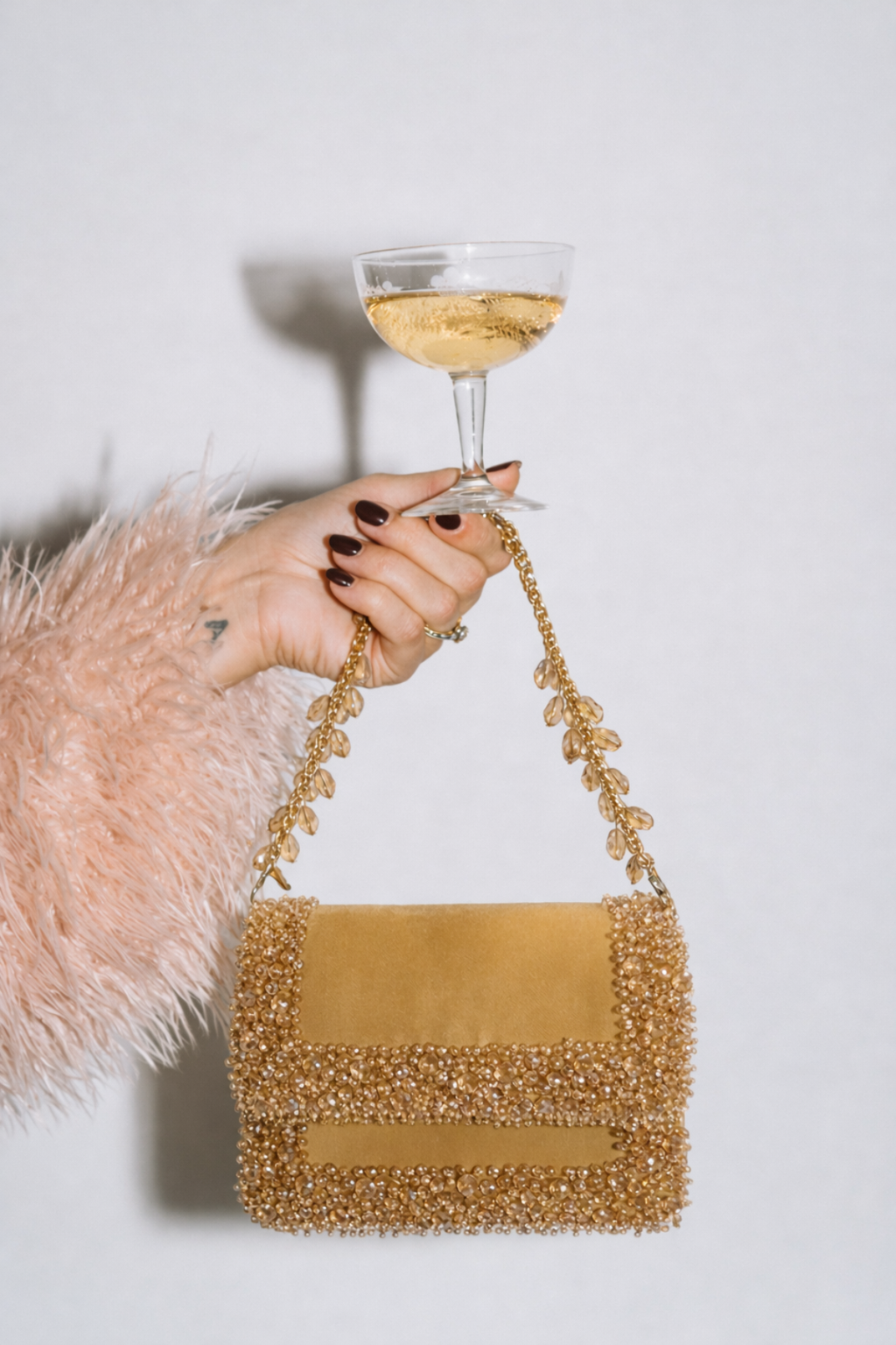 Golden evening party handbag inspired by glamorous celebrations and cocktail styling